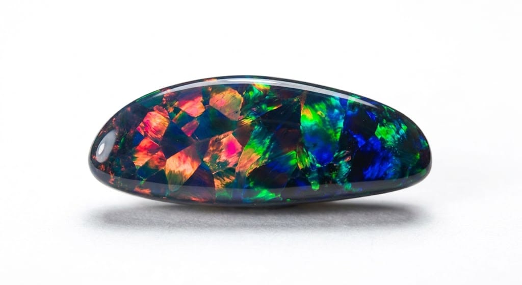 The strategic entry of natural black opal into the elite salons of international high jewelry represents a fascinating collision between raw outback grit and refined European aesthetics. When these dark, fire-filled stones first arrived in the northern hemisphere, they didn't just join the ranks of traditional precious gems—they actively disrupted the established order of luxury design.